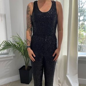Express black sequin jumpsuit. Size small. Stretchy waistband.